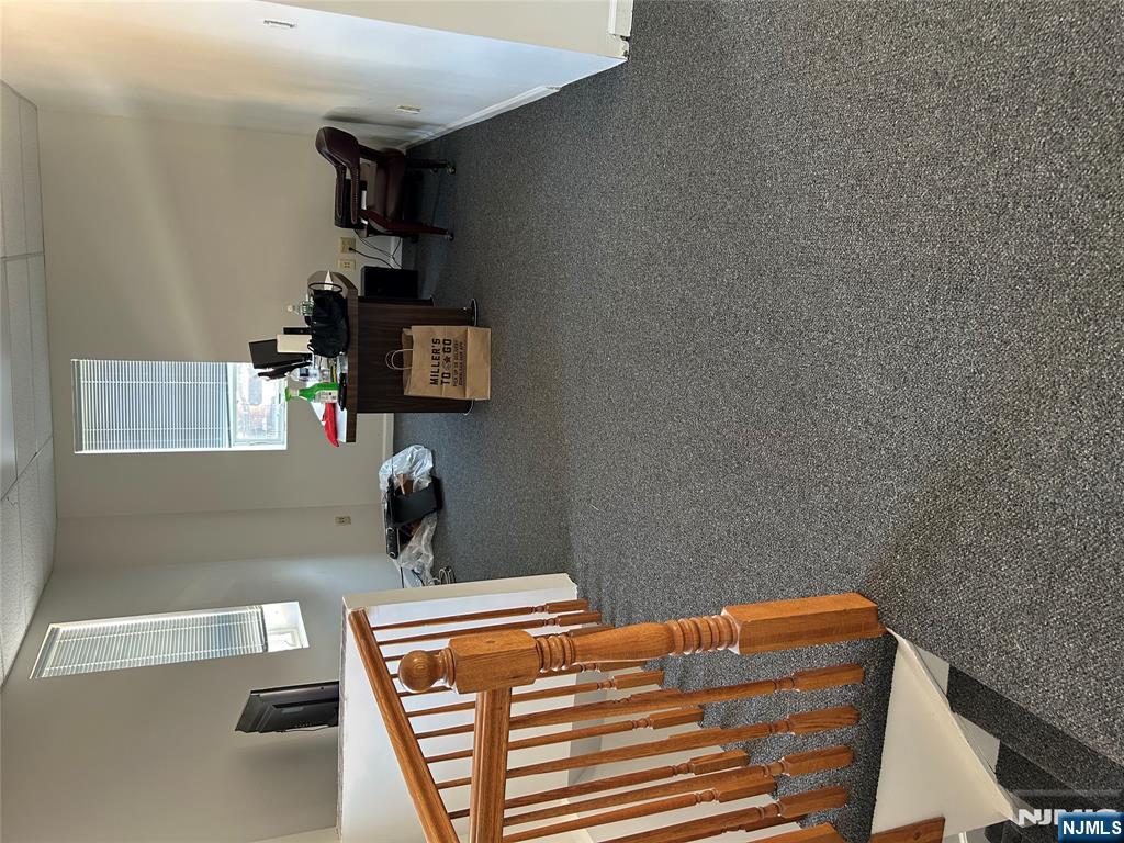 829 Main Street, Unit 2 Hackensack, NJ 07601 - Photo 5 of 8 a living room with furniture and a window