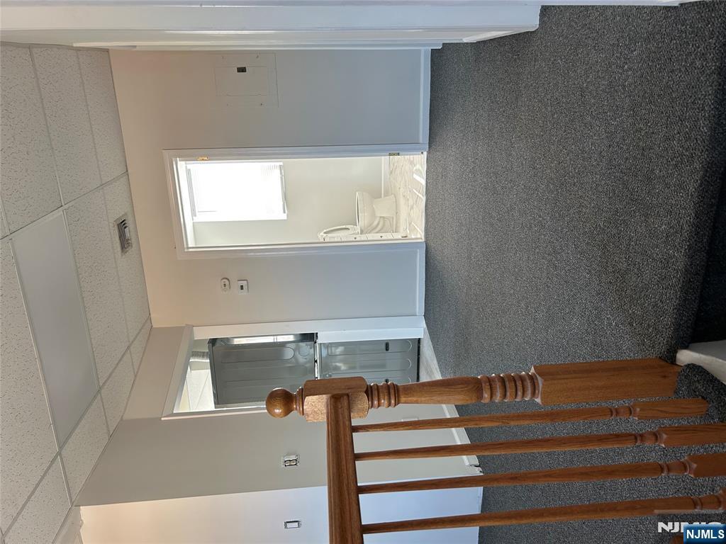 829 Main Street, Unit 2 Hackensack, NJ 07601 - Photo 6 of 8 a view of hallway with stairs