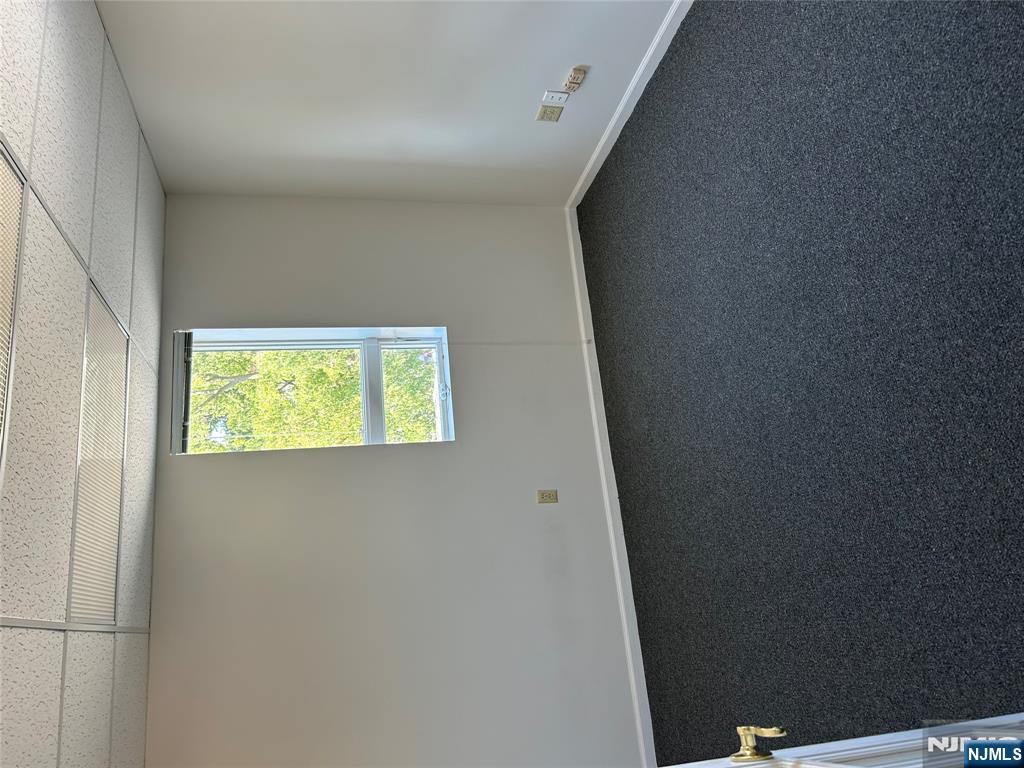 829 Main Street, Unit 2 Hackensack, NJ 07601 - Photo 7 of 8 an empty room with a window