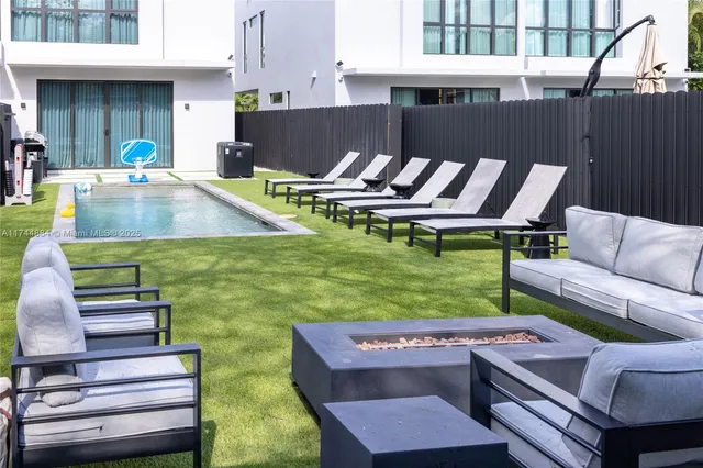 a kitchen with a table chairs and microwave