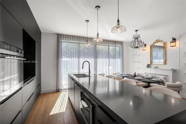 a bed room with furniture and paintings on the wall