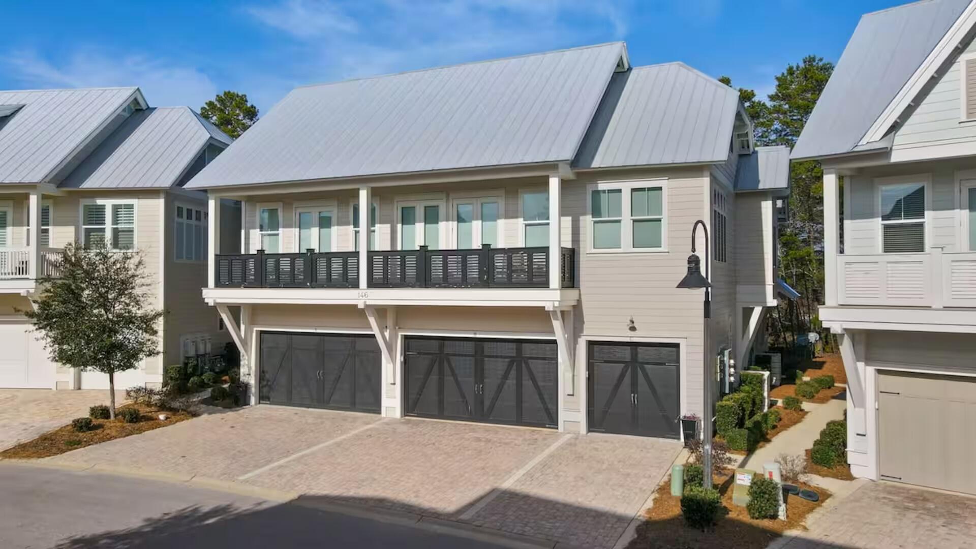 146 East E Pine, Unit B Inlet Beach, FL 32461 - Photo 2 of 47 a front view of a house with a garden