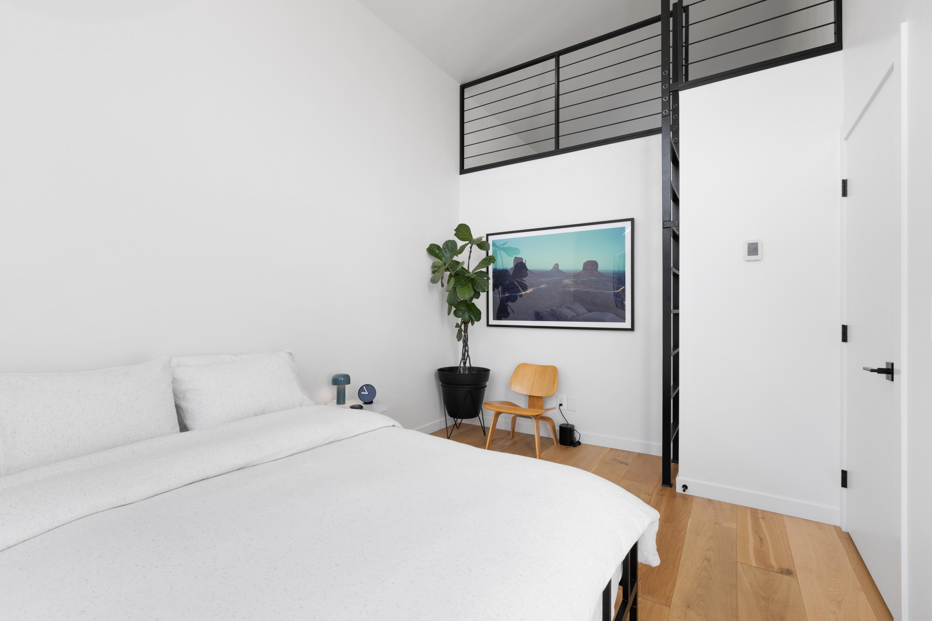 23204 Placid Road Palo Cedro, CA 96073 - Photo 32 of 71 a bedroom with a bed and a flat screen tv