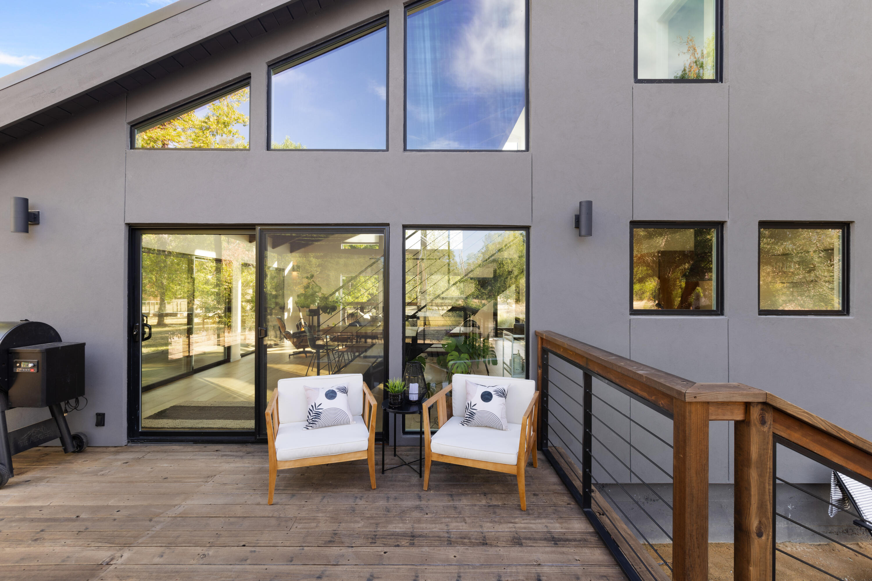 23204 Placid Road Palo Cedro, CA 96073 - Photo 46 of 71 a living room with furniture and a floor to ceiling window