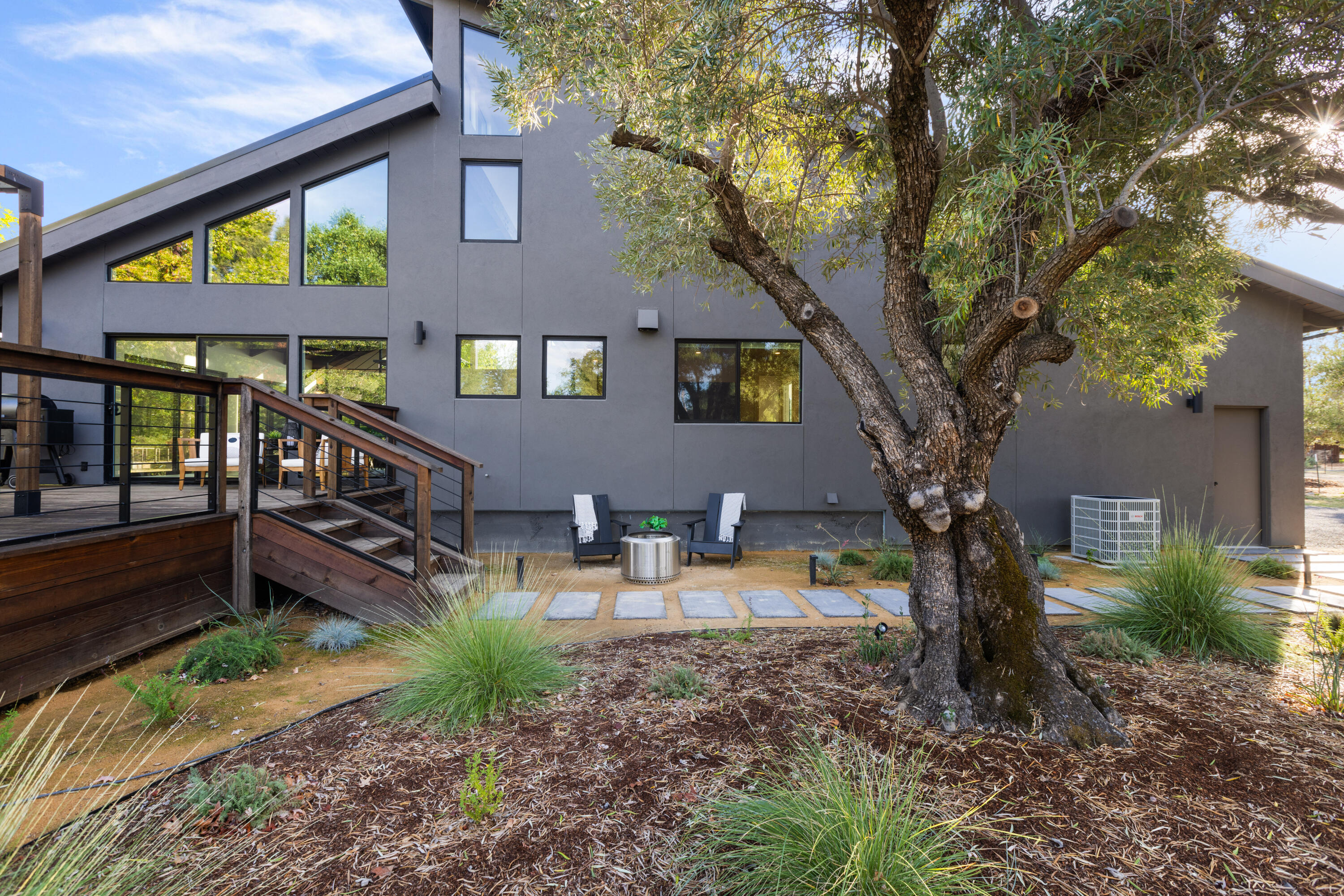 23204 Placid Road Palo Cedro, CA 96073 - Photo 48 of 71 a view of a house with backyard and sitting area