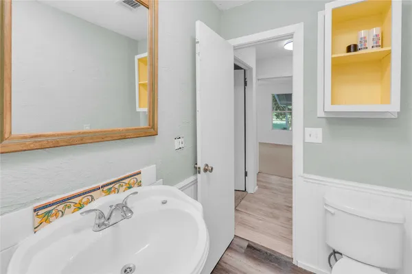 a bathroom with a bathtub and a sink