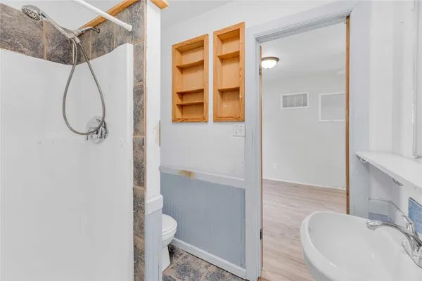 a bathroom that has a sink and a toilet