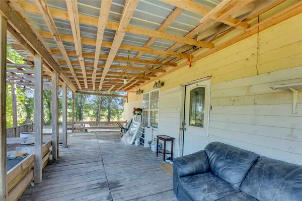 a view of a porch with seating space