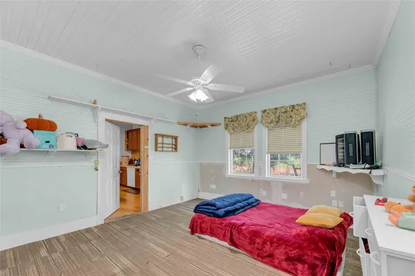 a bed room with a bed and a chandelier