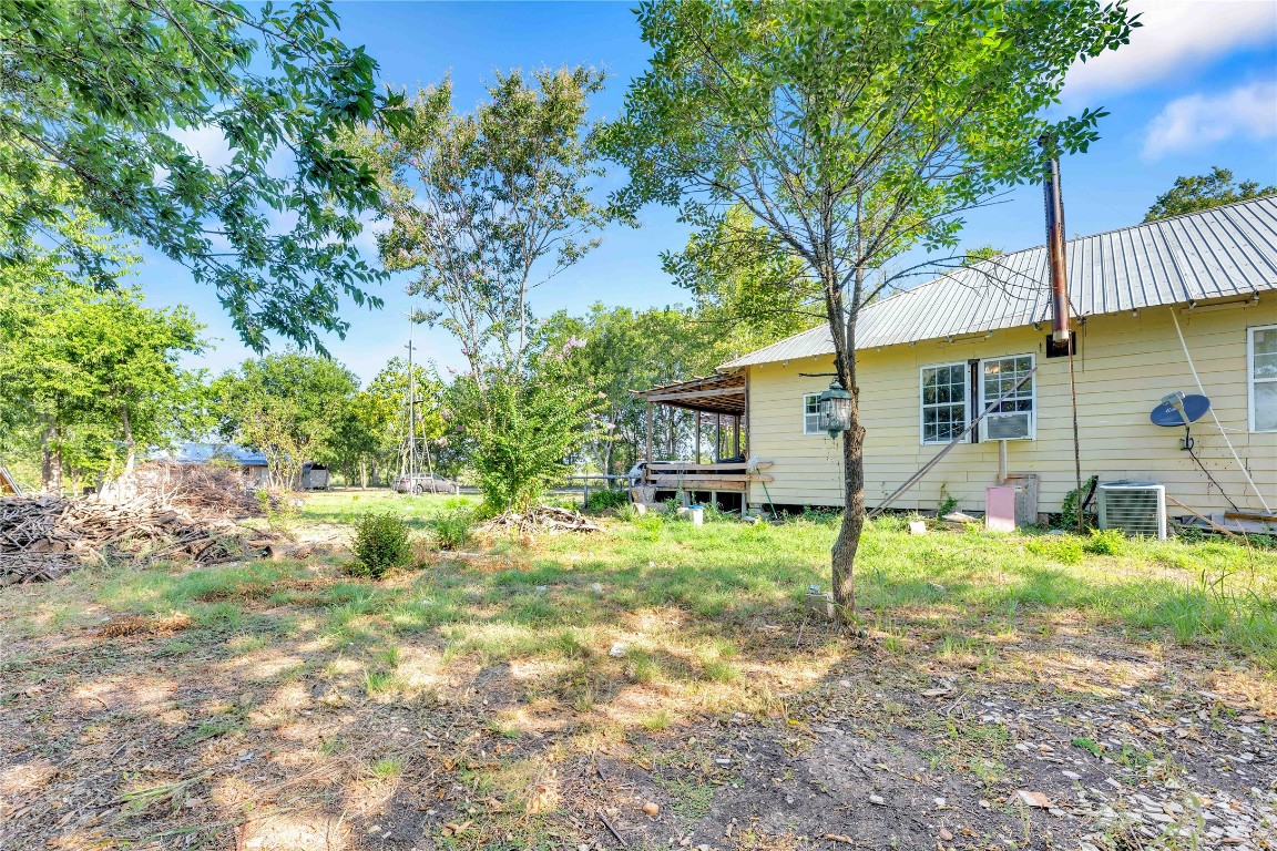 20235 Engelmann Lane Manor, TX 78653 - Photo 32 of 34 a backyard of a house with garden and patio
