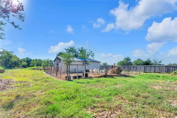a view of a backyard with a garden
