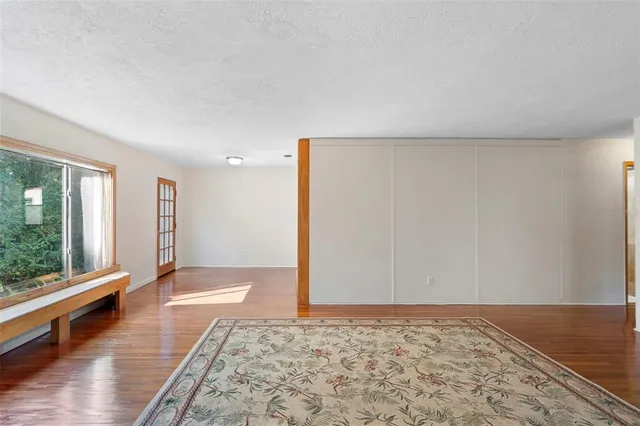 a view of an empty room and window