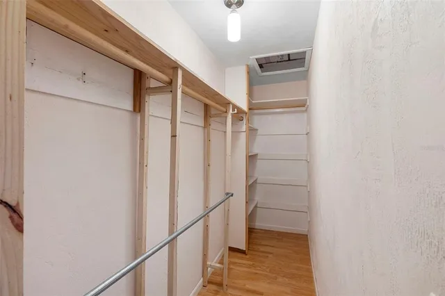 a bathroom with a granite countertop toilet sink and mirror