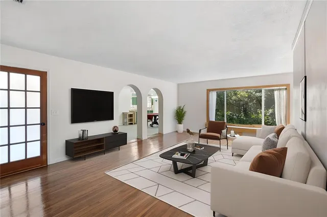 a living room with furniture and a flat screen tv