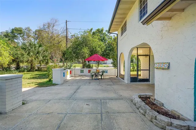 a view of a backyard of the house