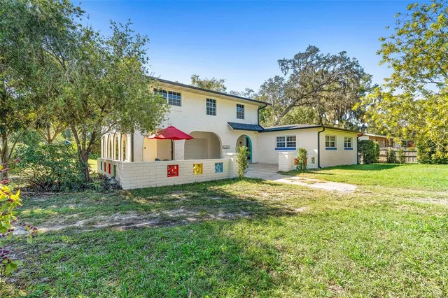 a view of house entrance and garden