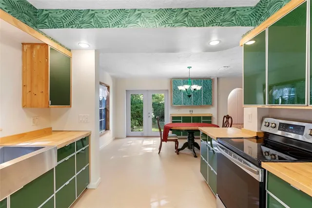 a kitchen with a sink and a stove top oven