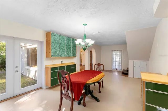 a view of a dining room with furniture and window