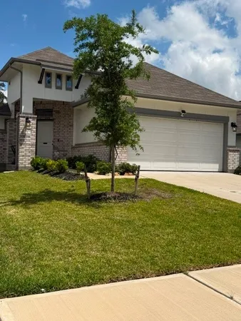 a large kitchen with stainless steel appliances and a large counter top