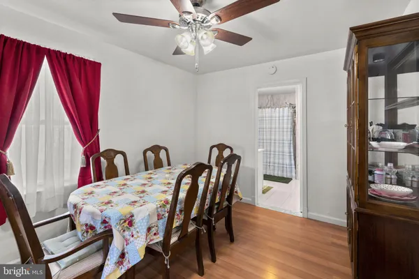 a view of a dining room with furniture and window