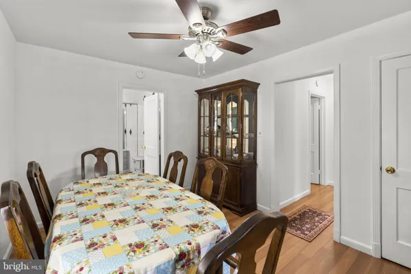 a view of a very nice looking dining room with furniture