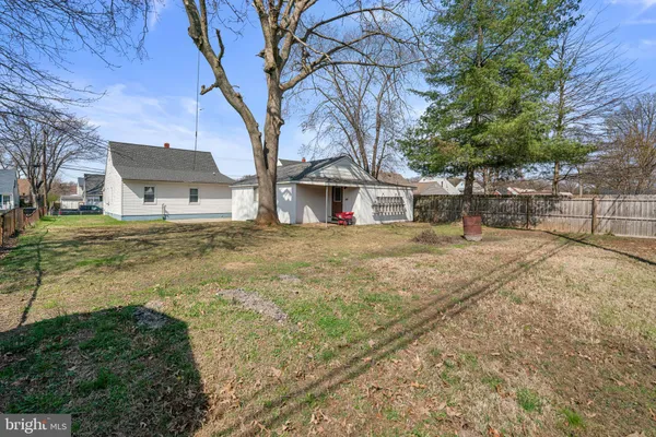 a house that has a tree in front of it