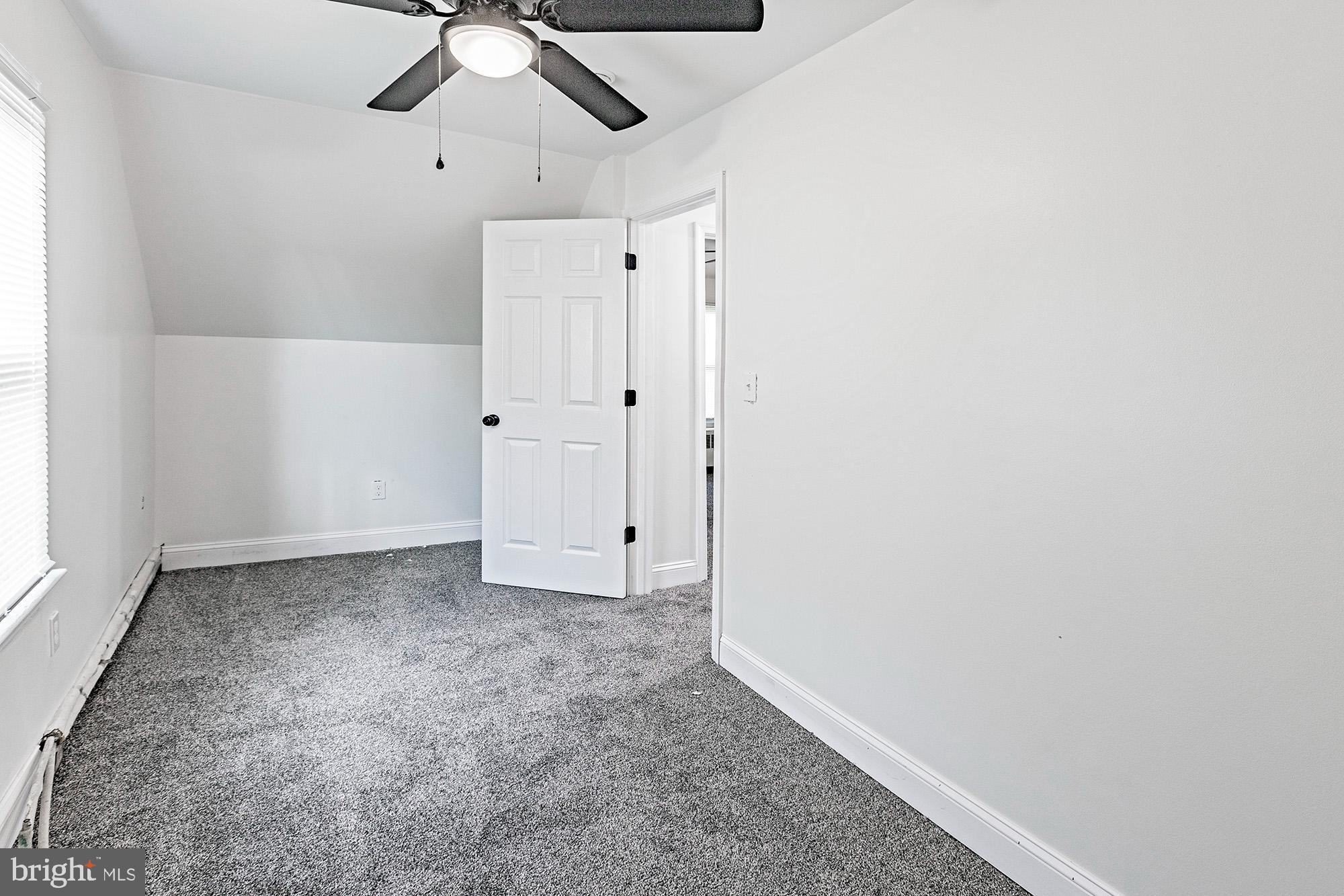 111 Grove Street Penns Grove, NJ 08069 - Photo 18 of 27 an empty room with chandelier fan