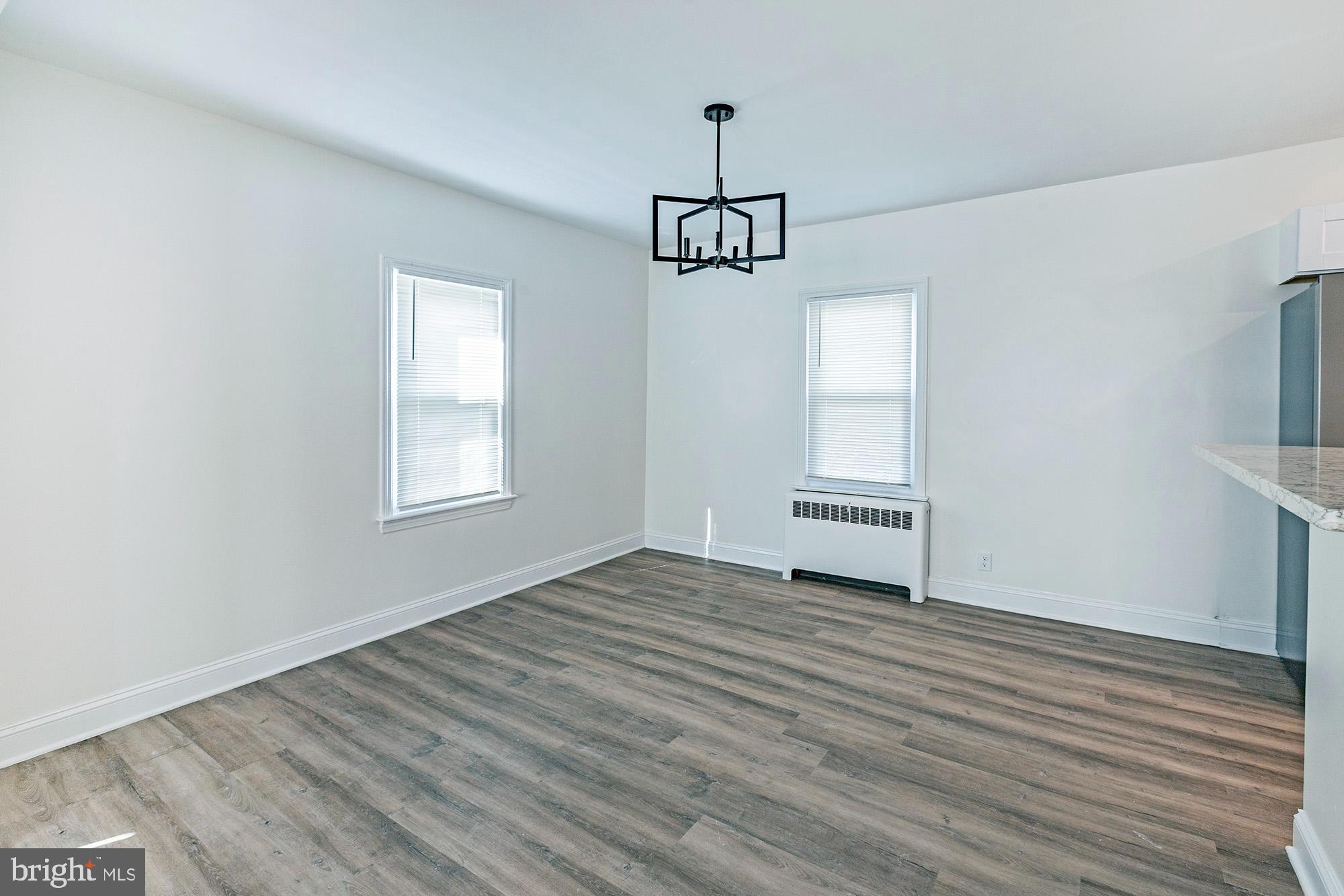 111 Grove Street Penns Grove, NJ 08069 - Photo 6 of 27 a view of empty room with wooden floor and window