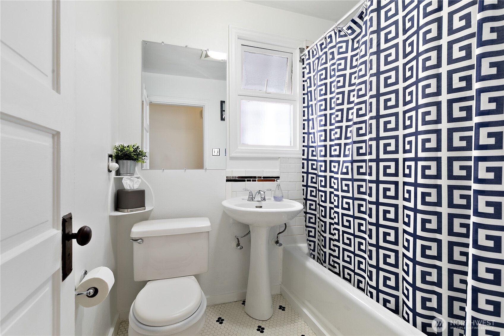6540 19th Avenue Northeast Seattle, WA 98115 - Photo 13 of 40 a bathroom with a sink and toilet