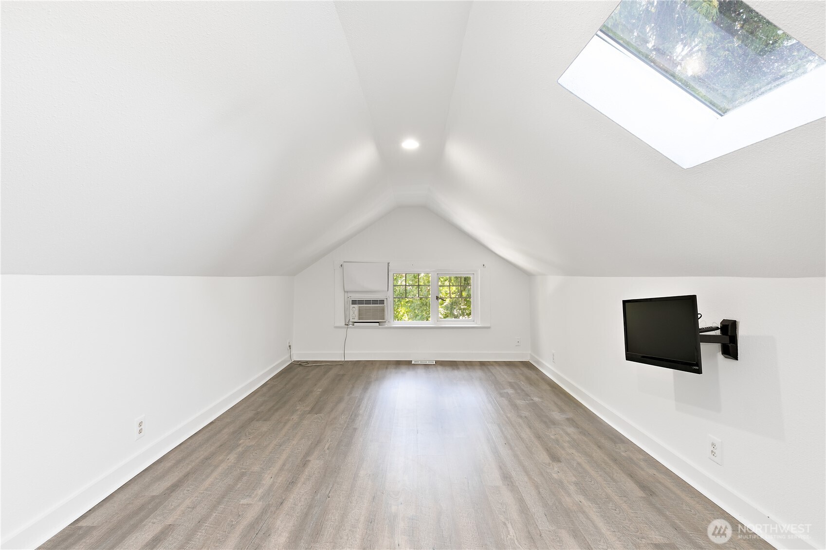 6540 19th Avenue Northeast Seattle, WA 98115 - Photo 19 of 40 a view of room with wooden floor and window