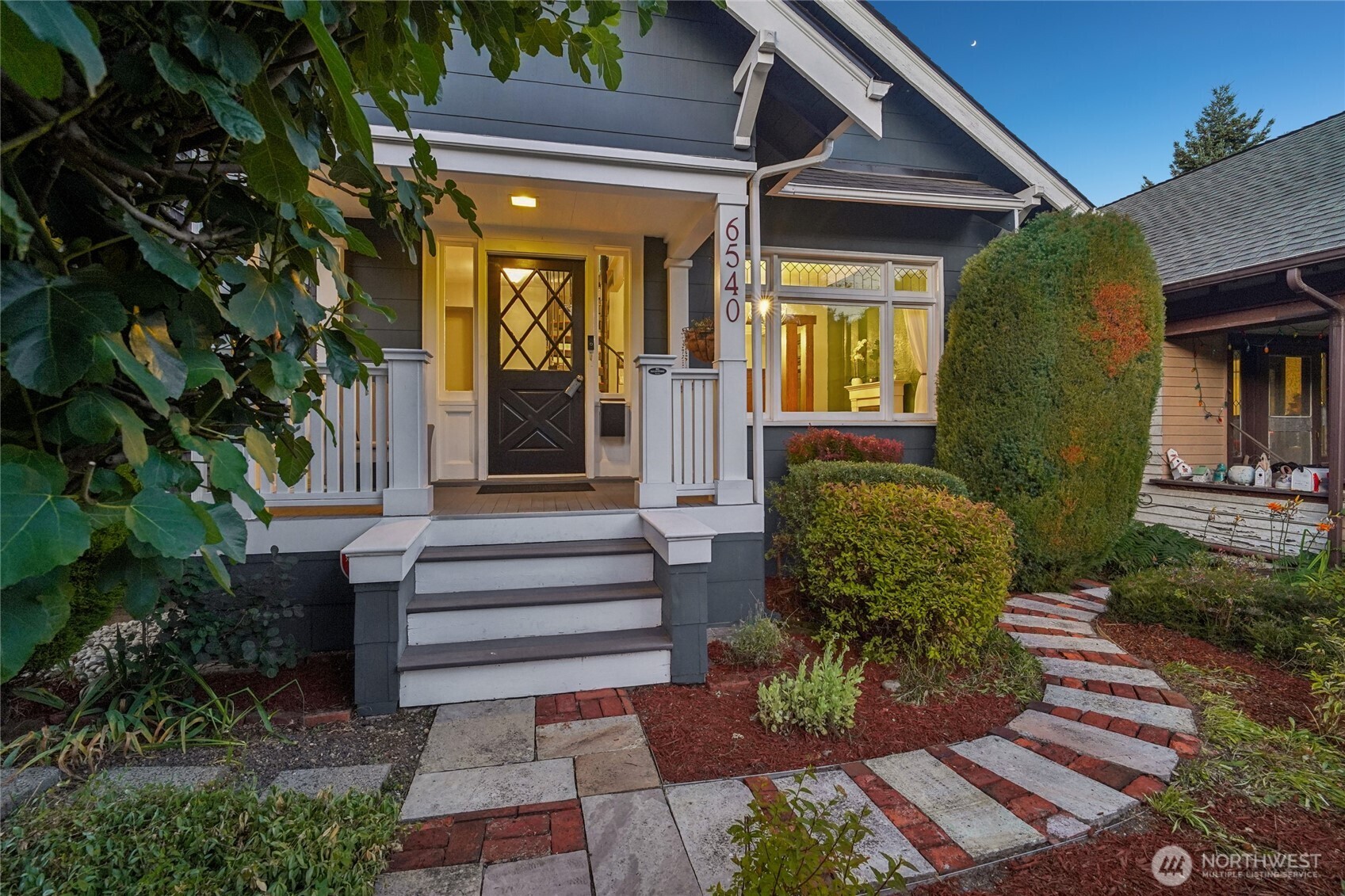 6540 19th Avenue Northeast Seattle, WA 98115 - Photo 2 of 40 a view of a house with a chairs in patio