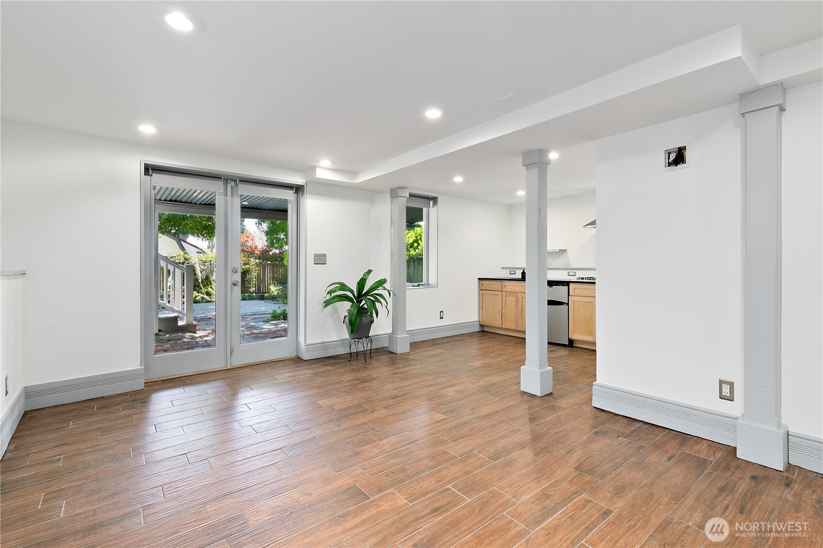 6540 19th Avenue Northeast Seattle, WA 98115 - Photo 21 of 40 a view of a kitchen with furniture and wooden floor