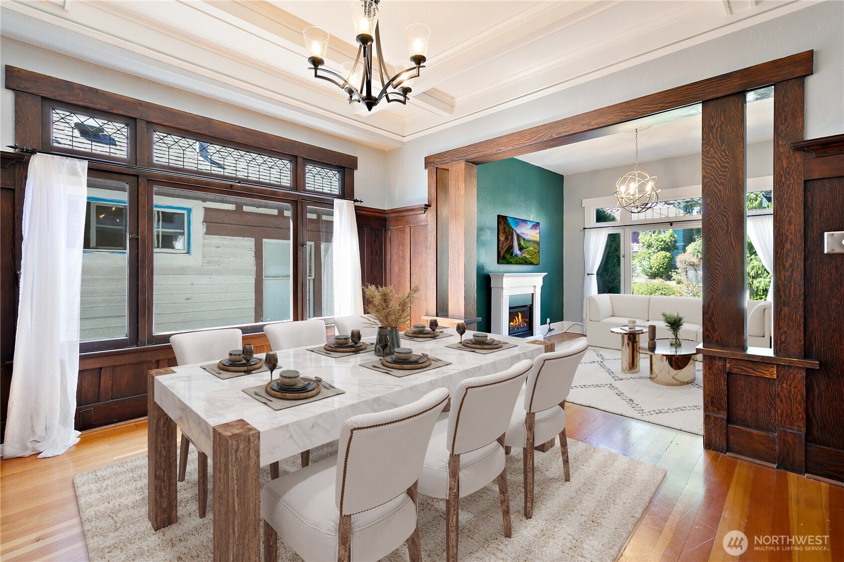 6540 19th Avenue Northeast Seattle, WA 98115 - Photo 7 of 40 a view of a dining room with furniture wooden floor and chandelier