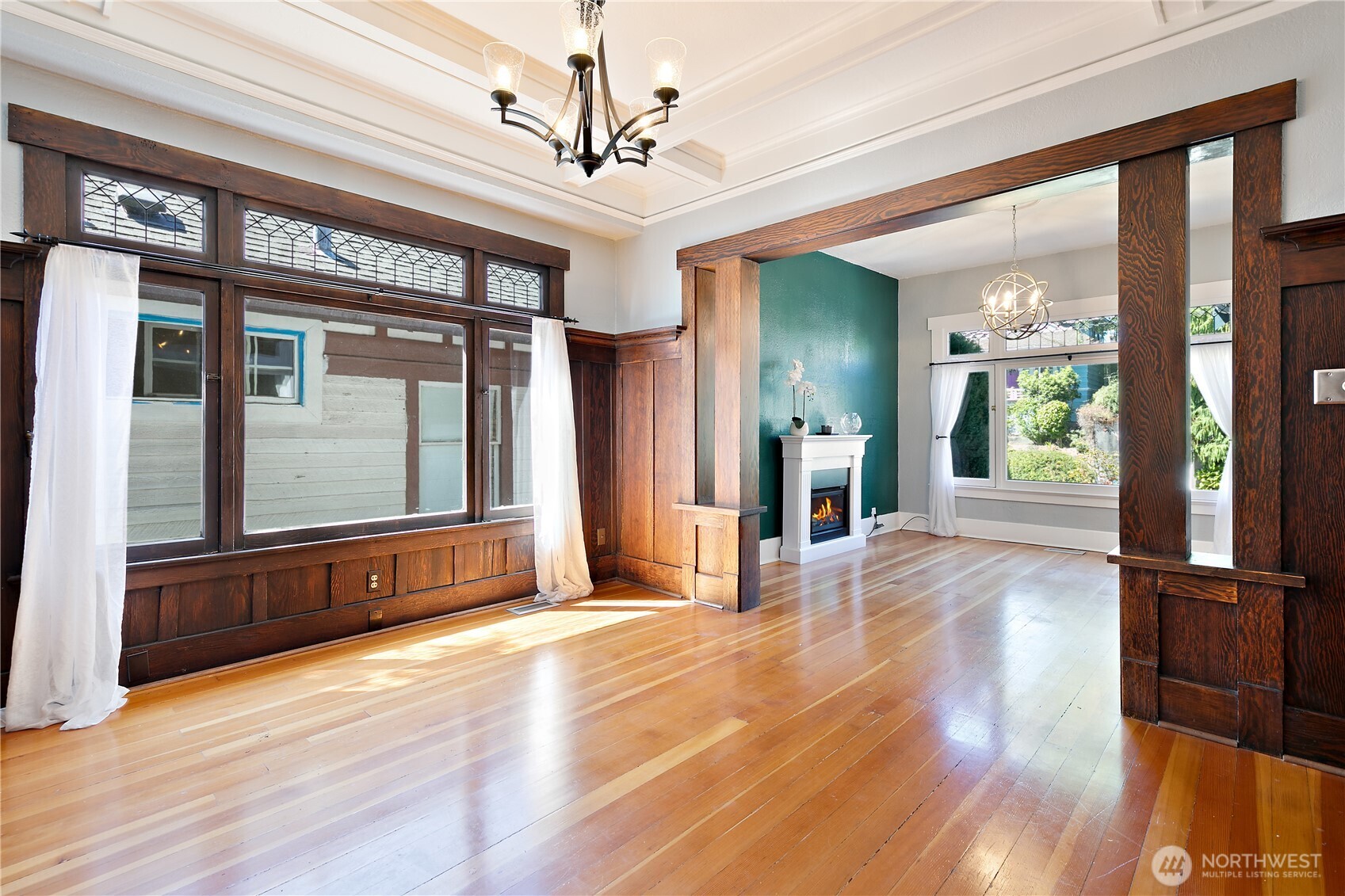 6540 19th Avenue Northeast Seattle, WA 98115 - Photo 8 of 40 a view of a big room with wooden floor windows and chandelier