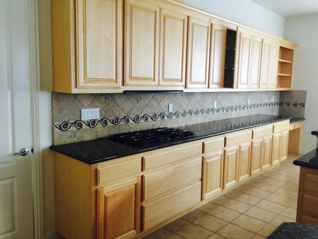 309 Carrick Circle Hayward, CA 94542 - Photo 5 of 12 a close view of a sink and dishwasher with white cabinets
