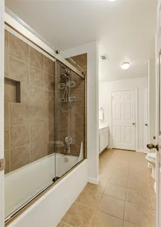 a bathroom with a shower and a bathtub