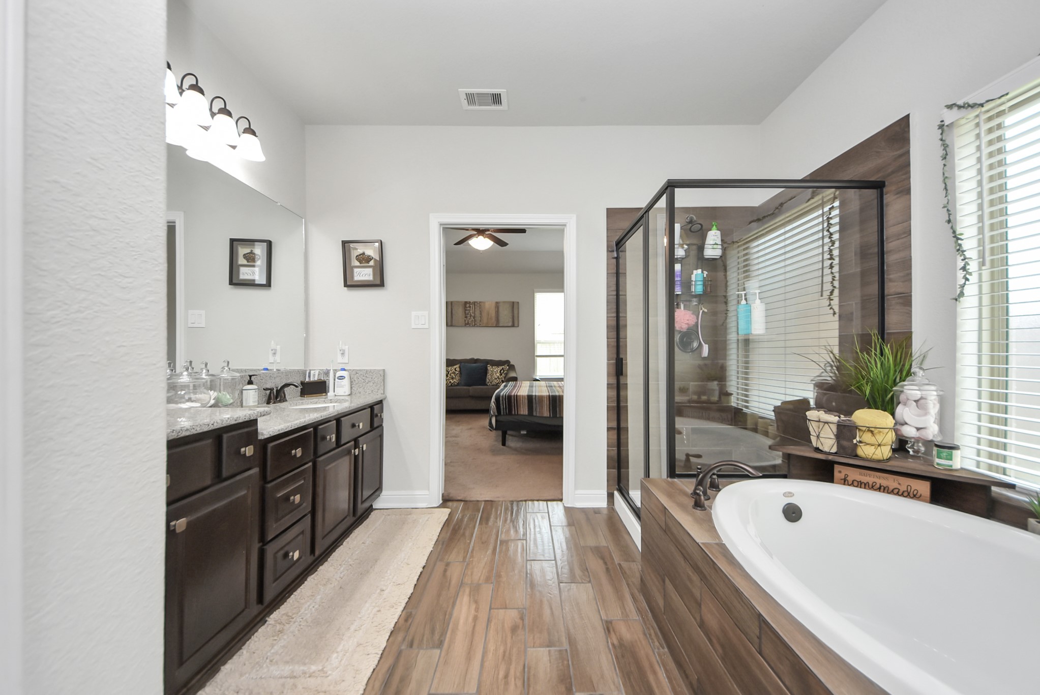 24503 Eucalyptus Way Spring, TX 77373 - Photo 9 of 27 a large bathroom with a large tub sink and glass door