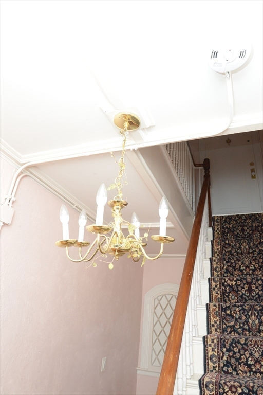 25 Baltimore Street, Unit 2/3 Lynn, MA 01902 - Photo 17 of 36 a view of chandelier in hallway