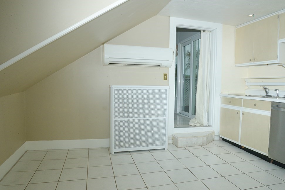 25 Baltimore Street, Unit 2/3 Lynn, MA 01902 - Photo 18 of 36 a view of a utility room with cabinets