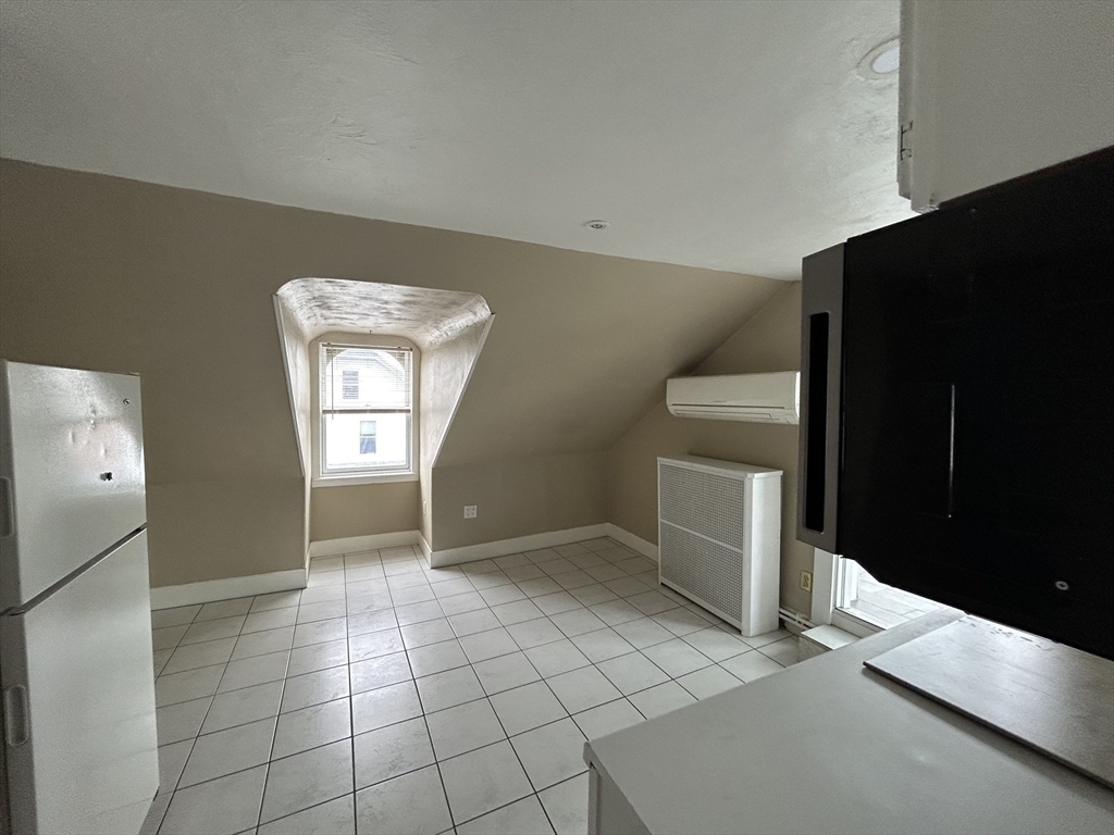 25 Baltimore Street, Unit 2/3 Lynn, MA 01902 - Photo 22 of 36 a view of an empty room with a window