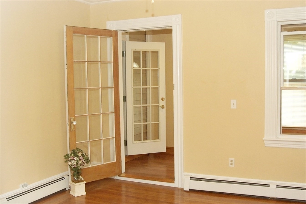 25 Baltimore Street, Unit 2/3 Lynn, MA 01902 - Photo 8 of 36 a view of a room with wooden floor and cabinet