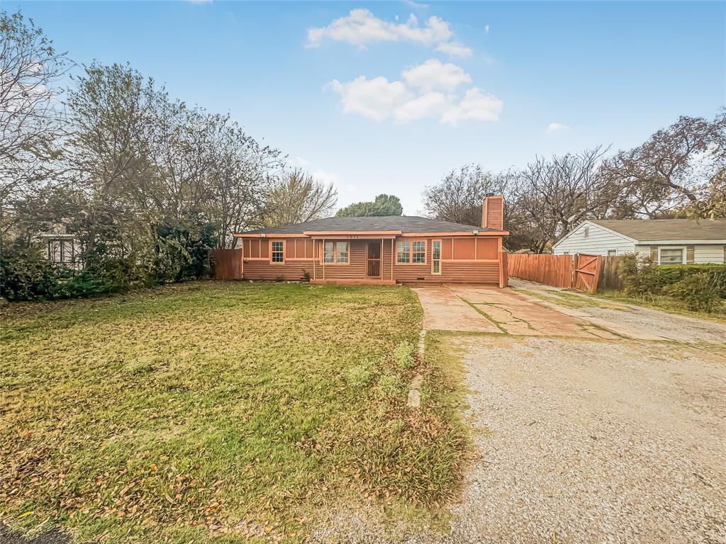 a view of a house with swimming pool next to a yard
