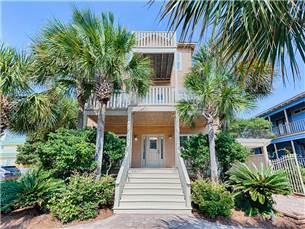 58 Sunfish Street Destin, FL 32541 - Photo 1 of 32 a front view of a house with a yard and trees