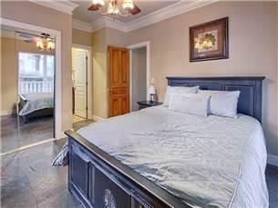 58 Sunfish Street Destin, FL 32541 - Photo 11 of 32 a bedroom with a bed and a painting on the wall