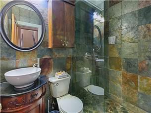 58 Sunfish Street Destin, FL 32541 - Photo 15 of 32 a white toilet sitting next to a bathroom sink and a mirror