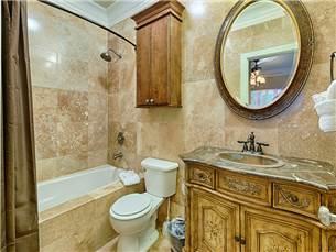 58 Sunfish Street Destin, FL 32541 - Photo 17 of 32 a bathroom with a sink a toilet and a mirror