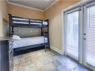 58 Sunfish Street Destin, FL 32541 - Photo 18 of 32 a bedroom with a bed and a window