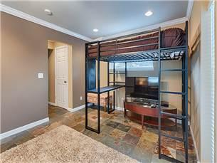 58 Sunfish Street Destin, FL 32541 - Photo 22 of 32 a living room with furniture a flat screen tv and a table