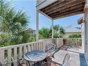 58 Sunfish Street Destin, FL 32541 - Photo 27 of 32 a view of a chair in wooden deck