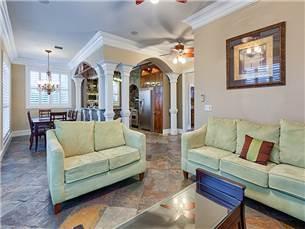 58 Sunfish Street Destin, FL 32541 - Photo 6 of 32 a living room with furniture and a chandelier